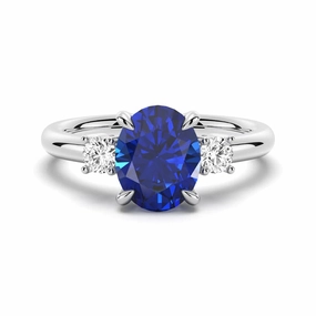 Charming Details Trendy Pieces 2 CT. Oval Blue Sapphire and White Sapphire Three Stone Ring