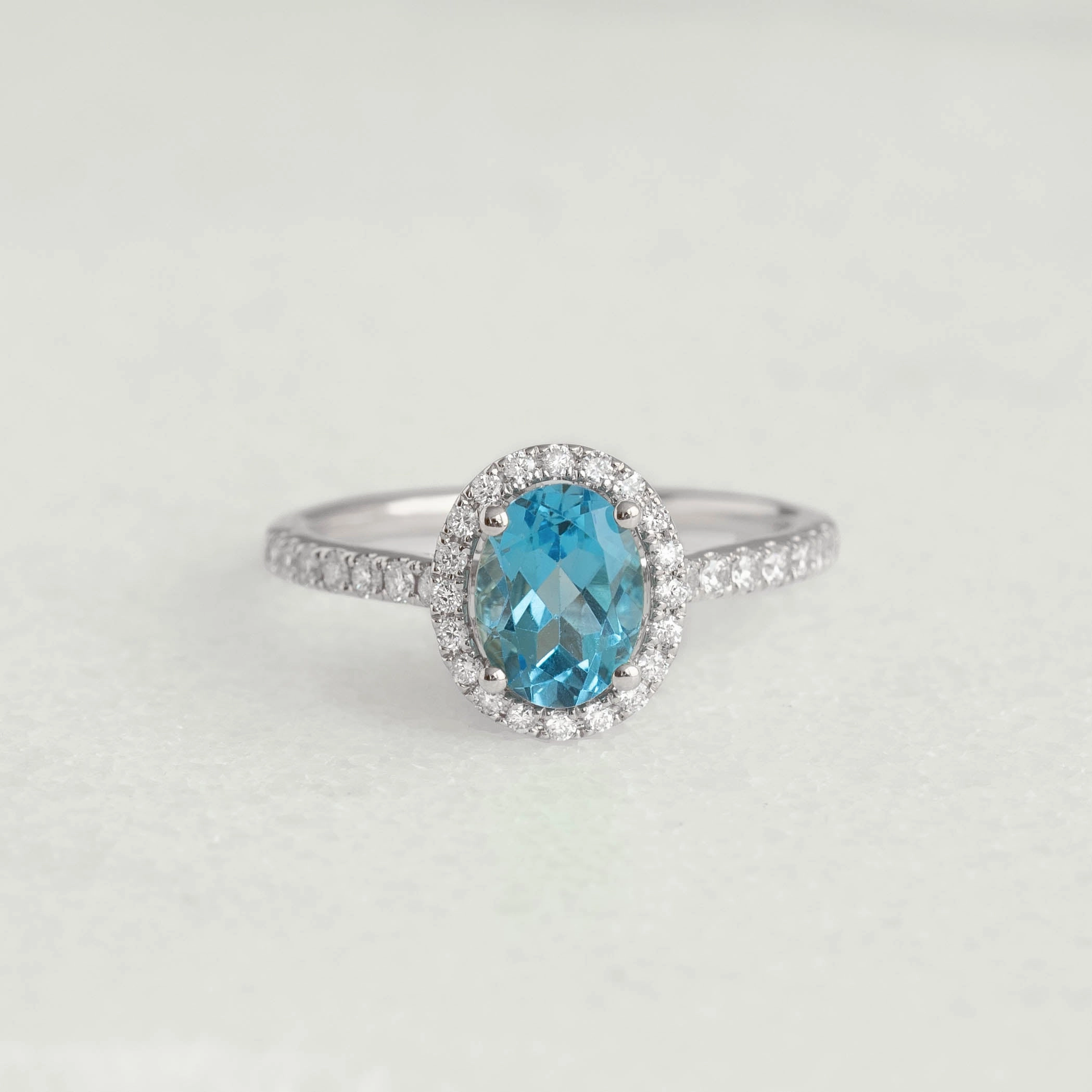 Oval Swiss Blue Topaz Halo Ring White Gold - Suna Distinctive Touch