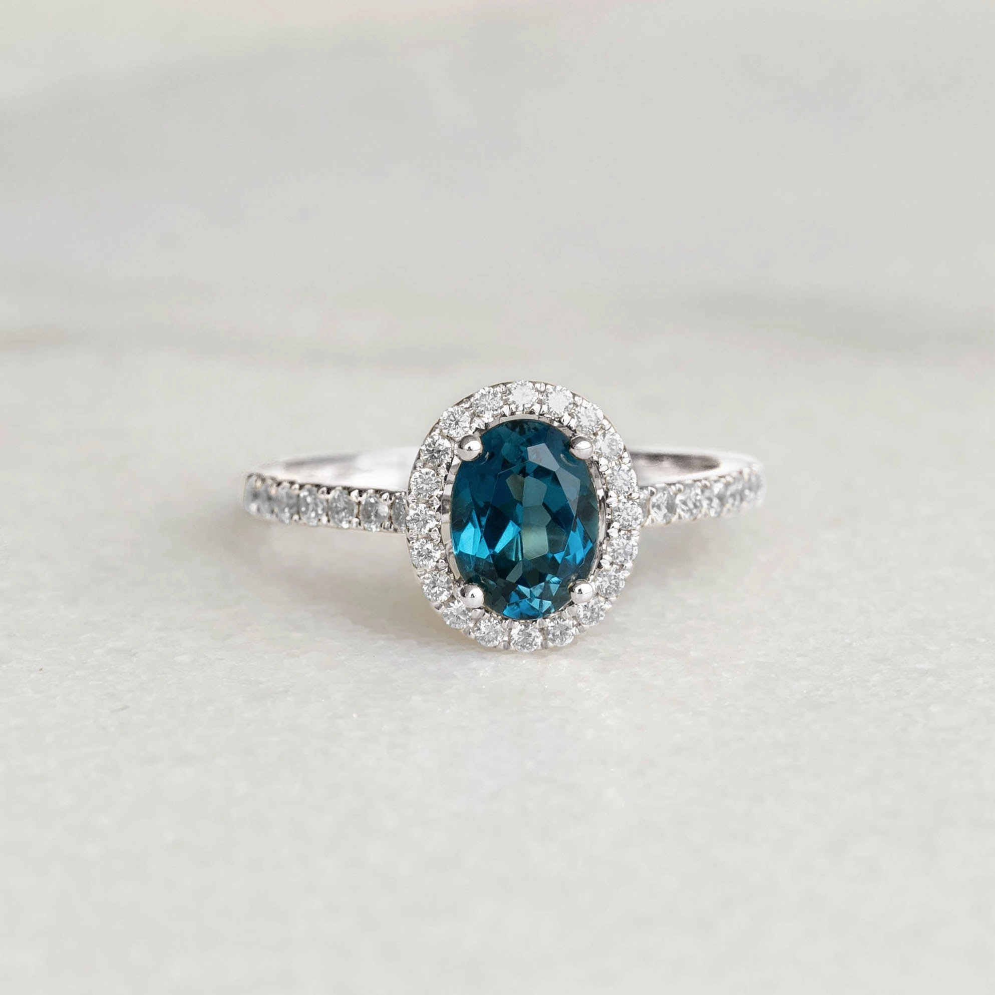 Graceful Lines Oval London Blue Topaz Halo Ring White Gold - Suna