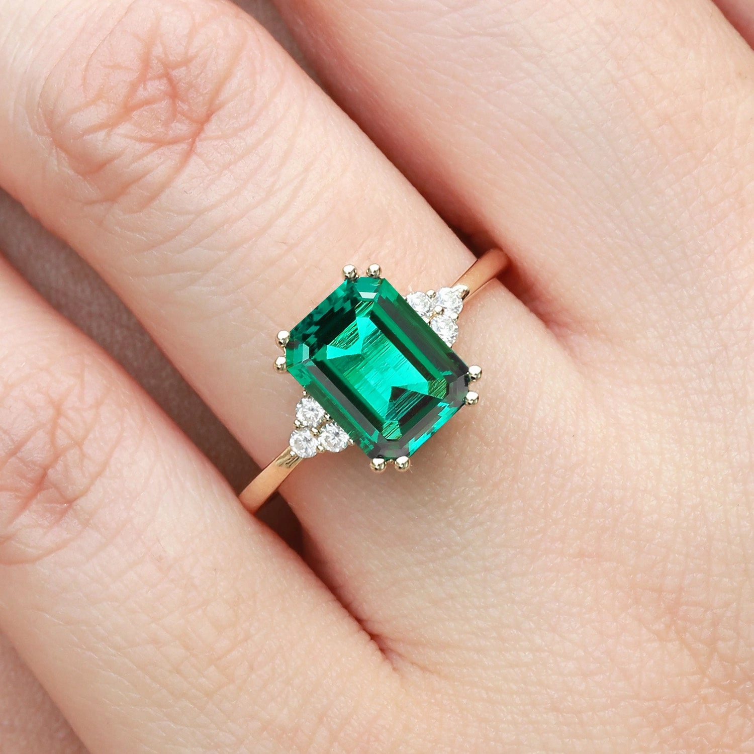 Elite Detail Emerald Cut Emerald & Moissanite Yellow Gold Ring