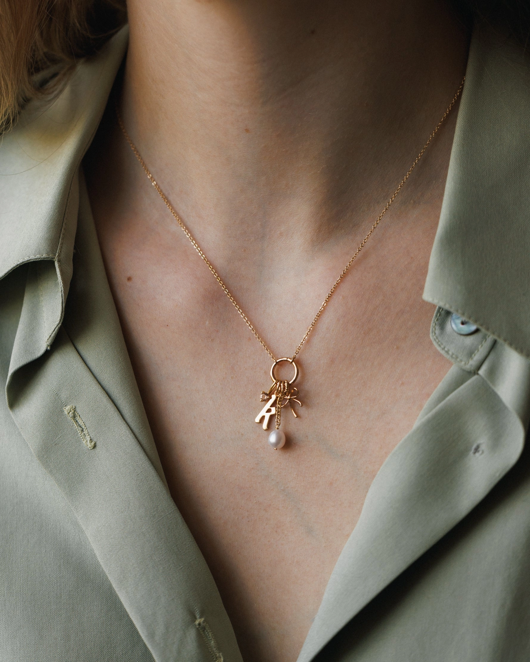 Suspended Pearl Charm Golden Light