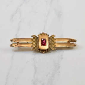 Polished Detail Victorian Oval Cut Garnet Brooch | 0.30ct |